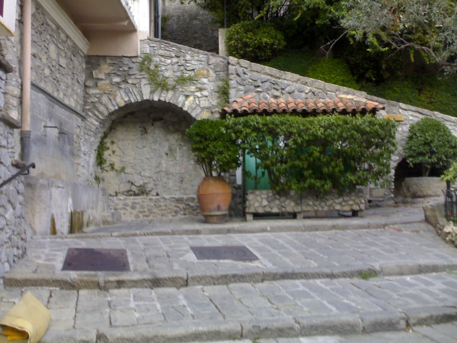 © Jpmgir A doorway and cobbled lane in Lucéram, Alpes-Maritimes