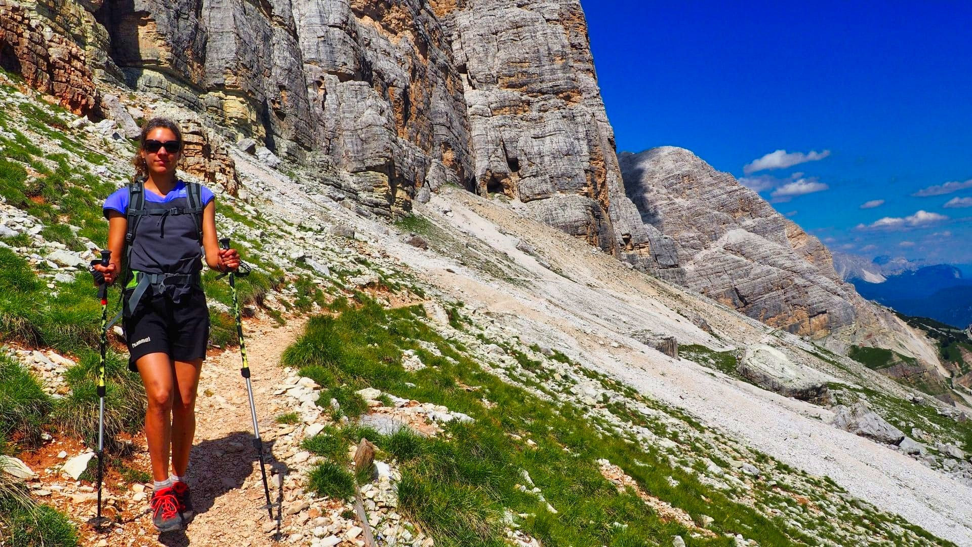 Hiker below Tofana di Rozes on the Alta Via 1 - Dolomites - Italy