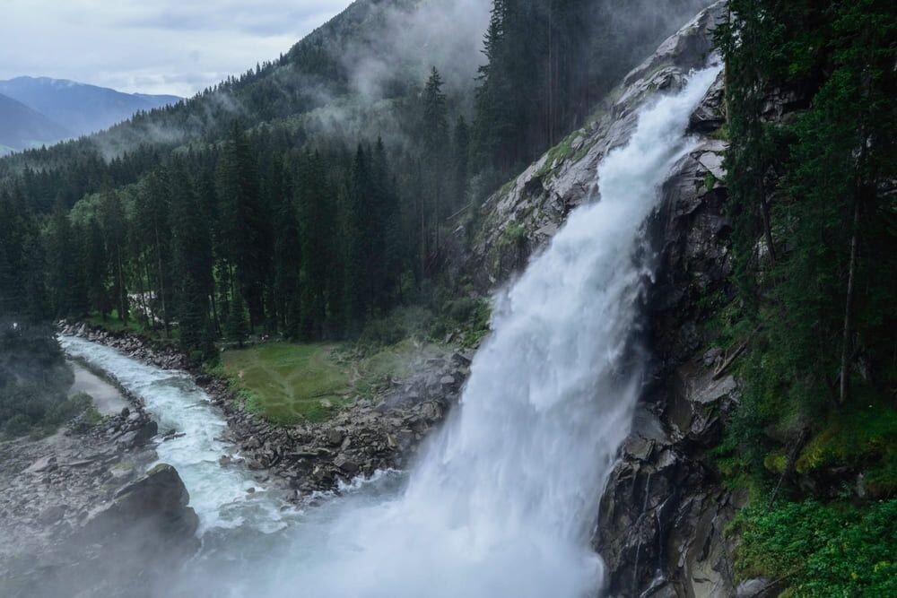 Krimml Waterfall and the torrent between wooded slopes