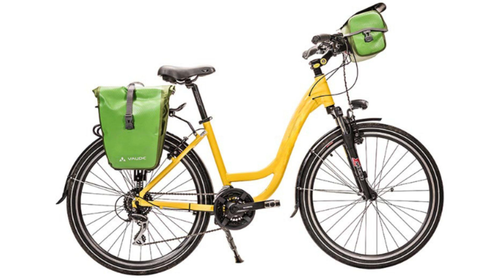 Vélo de randonnée jaune avec sacoches vertes - Équipement cyclotourisme